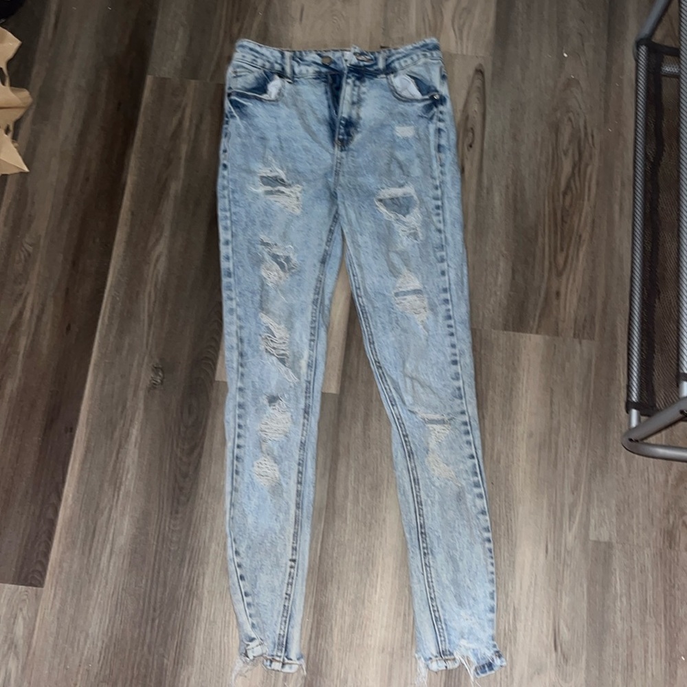 Size three severely ripped jeans